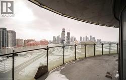 Balcony featuring a view of skyline - 