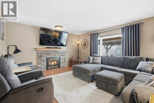 940 Citadel Drive Nw, Calgary, AB - Indoor Photo Showing Living Room With Fireplace