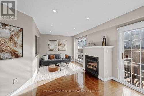 Great room (Virtually Staged). - 20 Fieldberry Private, Ottawa, ON - Indoor Photo Showing Living Room With Fireplace