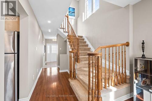 Stairs up to second level w vertical window. - 20 Fieldberry Private, Ottawa, ON - Indoor Photo Showing Other Room