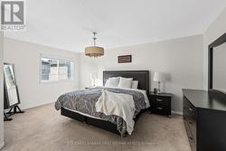 Primary bedroom w dbl door entry & walk in closet. - 