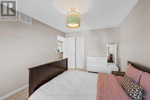 Includes dbl door sliding closet. - 20 Fieldberry Private, Ottawa, ON - Indoor Photo Showing Bedroom