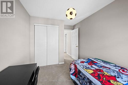 Dbl door closet & light fixture above. - 20 Fieldberry Private, Ottawa, ON - Indoor Photo Showing Bedroom