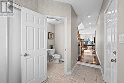Inside access to the garage & powder room. - 