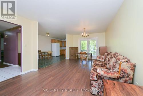 Long Living room with walk out to back yard - 28 Wilson Crescent, Southgate, ON - Indoor Photo Showing Living Room