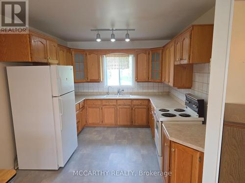 new flooring, lots of cabinets - 28 Wilson Crescent, Southgate, ON - Indoor Photo Showing Kitchen With Double Sink
