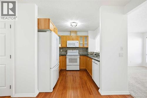132 Royal Birch Mount Nw, Calgary, AB - Indoor Photo Showing Kitchen With Double Sink