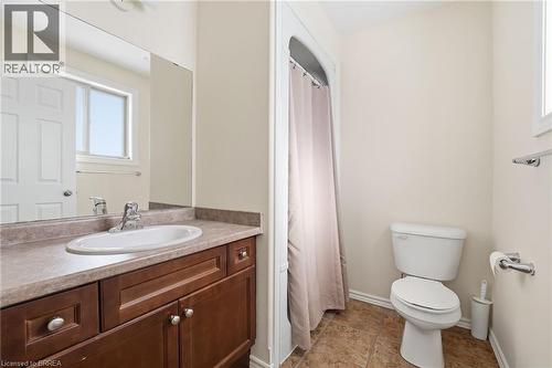 Full bath with a shower with curtain, vanity, and plenty of natural light - 28 Mansfield Drive, St. George, ON - Indoor Photo Showing Bathroom
