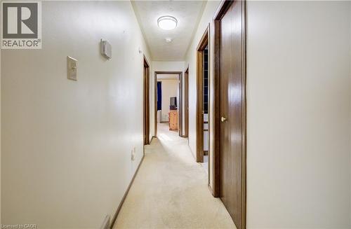 Hall featuring light carpet and baseboards - 42 Ruffian Road, Brantford, ON - Indoor Photo Showing Other Room