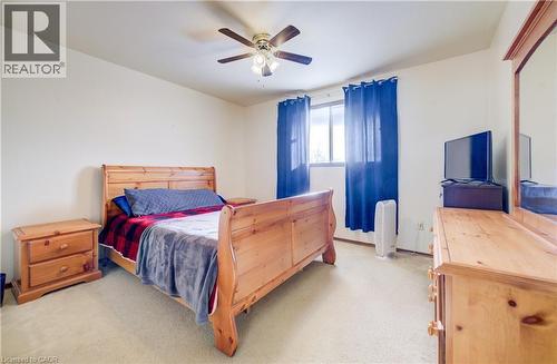 Bedroom 2 with light carpet and a ceiling fan - 42 Ruffian Road, Brantford, ON - Indoor Photo Showing Bedroom