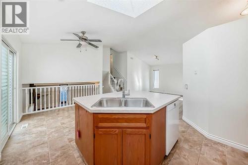 9875 Hidden Valley Drive Nw, Calgary, AB - Indoor Photo Showing Kitchen With Double Sink