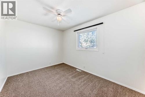 Bedroom 2 - 9875 Hidden Valley Drive Nw, Calgary, AB - Indoor Photo Showing Other Room