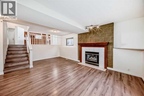 9875 Hidden Valley Drive Nw, Calgary, AB - Indoor Photo Showing Other Room With Fireplace