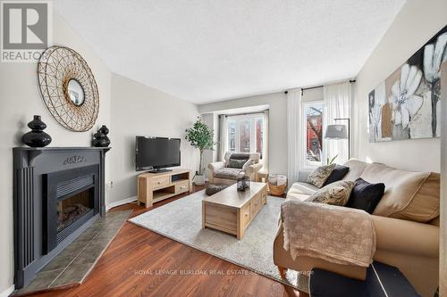 702 - 895 Maple Avenue, Burlington, ON - Indoor Photo Showing Living Room With Fireplace