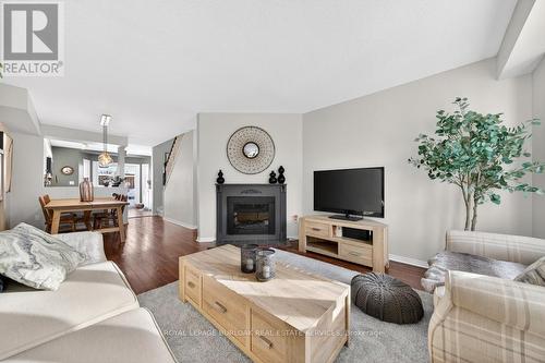702 - 895 Maple Avenue, Burlington, ON - Indoor Photo Showing Living Room With Fireplace