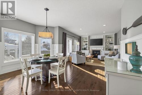 56 Fieldstone Crescent S, Middlesex Centre (Komoka), ON - Indoor Photo Showing Dining Room With Fireplace