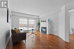 Living room with fireplace and backyard entry - 