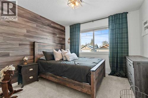 Bedroom 2 - 311 Mcleod Crescent, Diamond Valley, AB - Indoor Photo Showing Bedroom