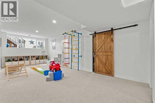 Large windows - 311 Mcleod Crescent, Diamond Valley, AB - Indoor Photo Showing Other Room