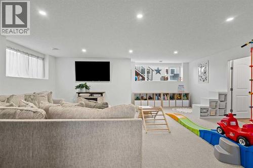 Downstairs living room - 311 Mcleod Crescent, Diamond Valley, AB - Indoor