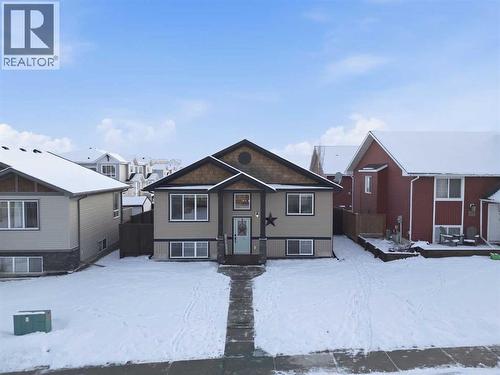 311 Mcleod Crescent, Diamond Valley, AB - Outdoor With Facade