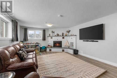 86 Township Park Road, North Algona Wilberforce, ON - Indoor Photo Showing Living Room With Fireplace
