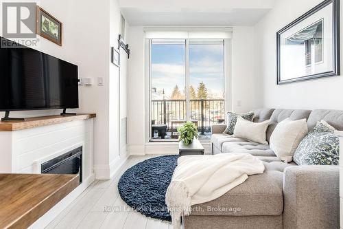 219 - 1 Hume Street, Collingwood, ON - Indoor Photo Showing Living Room With Fireplace