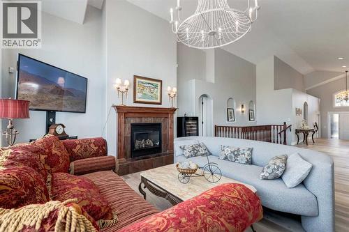 79 Discovery Ridge Park Sw, Calgary, AB - Indoor Photo Showing Living Room With Fireplace