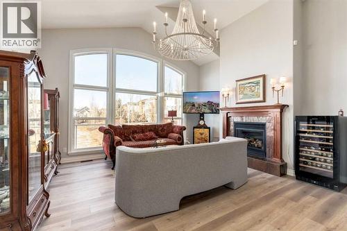 79 Discovery Ridge Park Sw, Calgary, AB - Indoor Photo Showing Living Room With Fireplace
