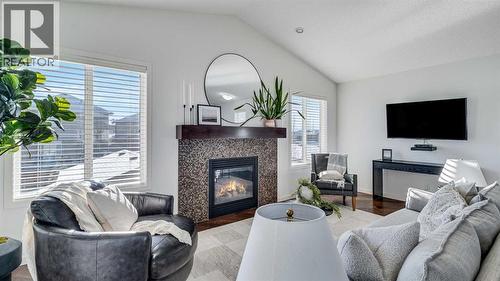 389 Cranberry Circle Se, Calgary, AB - Indoor Photo Showing Living Room With Fireplace