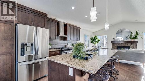 389 Cranberry Circle Se, Calgary, AB - Indoor Photo Showing Kitchen With Fireplace With Upgraded Kitchen