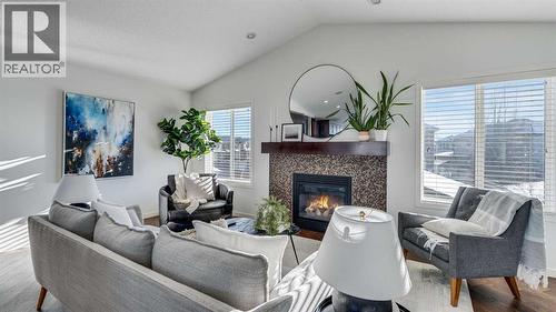 389 Cranberry Circle Se, Calgary, AB - Indoor Photo Showing Living Room With Fireplace