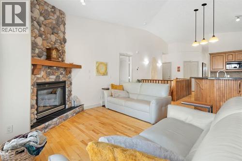 20 Ranch Road, Okotoks, AB - Indoor Photo Showing Living Room With Fireplace