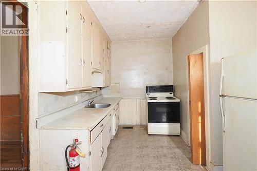 Kitchen featuring light countertops, white appliances, light flooring, and white cabinetry - 37 Northumberland Street, Ayr, ON - Indoor