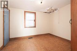 Empty room featuring baseboards - 