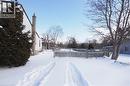 Yard covered in snow featuring a deck - 37 Northumberland Street, Ayr, ON  - Outdoor 