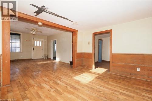 Unfurnished living room with light wood-type flooring and wood walls - 37 Northumberland Street, Ayr, ON - Indoor Photo Showing Other Room