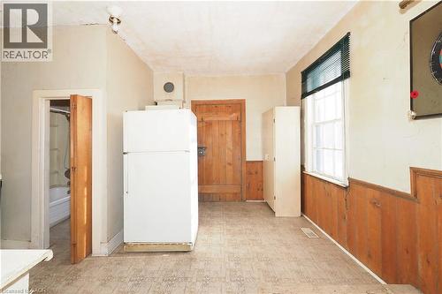 Kitchen with wooden walls, wainscoting, freestanding refrigerator, and light floors - 37 Northumberland Street, Ayr, ON - Indoor