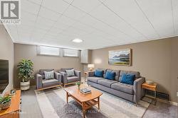 Downstairs family room (virtually staged) - 