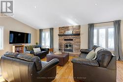 Stone fireplace with efficient wood-burning insert - 