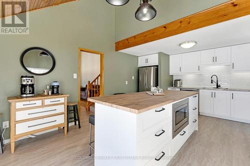 Breakfast island with built-in microwave - 100 Nagle Way, Tay Valley, ON - Indoor Photo Showing Kitchen With Upgraded Kitchen