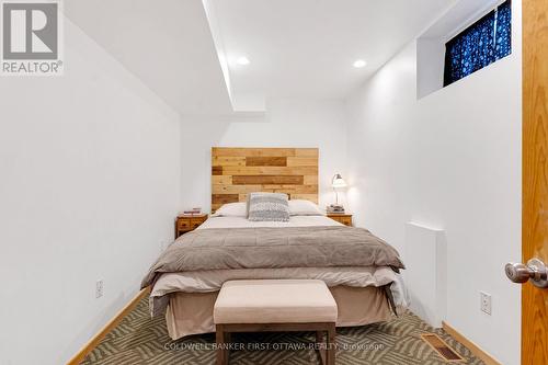 Lower level den currently set up as bedroom - 100 Nagle Way, Tay Valley, ON - Indoor Photo Showing Bedroom