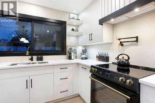2416 Palliser Drive Sw, Calgary, AB - Indoor Photo Showing Kitchen With Double Sink