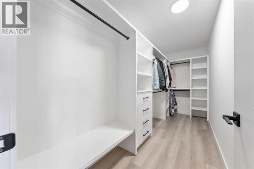 Large closet - 27 Bridges Drive, Langdon, AB - Indoor With Storage