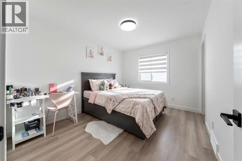 27 Bridges Drive, Langdon, AB - Indoor Photo Showing Bedroom
