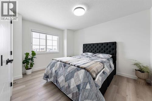 27 Bridges Drive, Langdon, AB - Indoor Photo Showing Bedroom