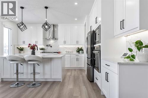 Quartz Countertops - 27 Bridges Drive, Langdon, AB - Indoor Photo Showing Kitchen With Stainless Steel Kitchen With Upgraded Kitchen
