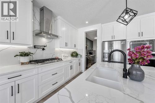 Gas Cooktop - 27 Bridges Drive, Langdon, AB - Indoor Photo Showing Kitchen With Upgraded Kitchen