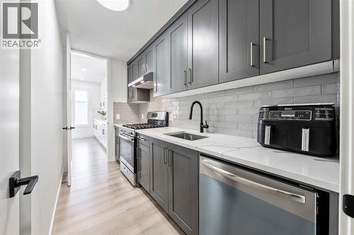 27 Bridges Drive, Langdon, AB - Indoor Photo Showing Kitchen With Stainless Steel Kitchen With Upgraded Kitchen