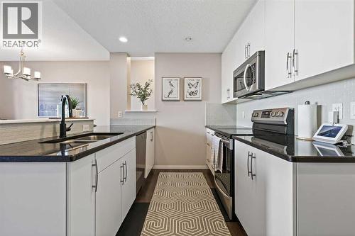 26 Chaparral Valley Common Se, Calgary, AB - Indoor Photo Showing Kitchen With Stainless Steel Kitchen With Double Sink With Upgraded Kitchen